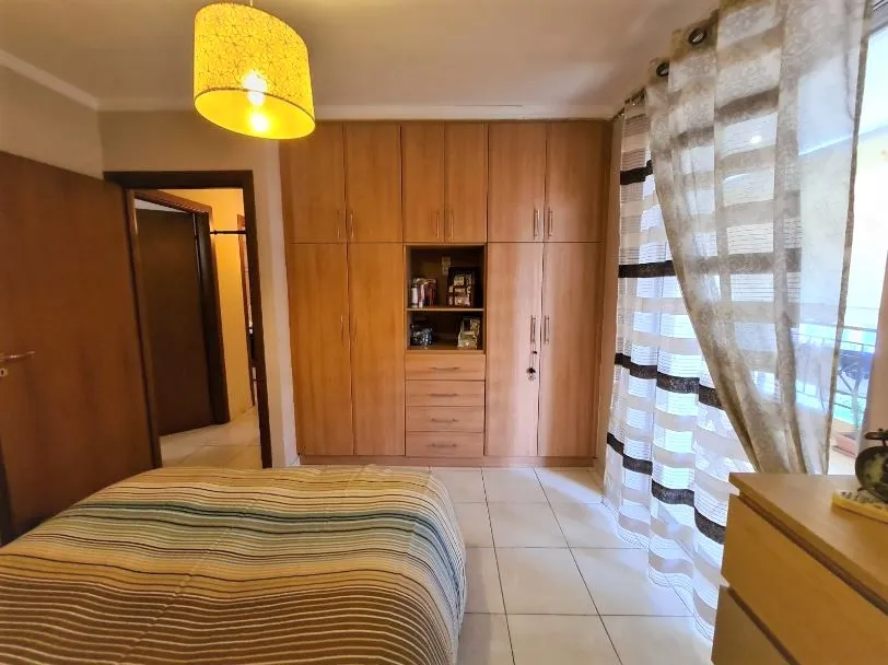 large wardrobes in the bedroom apartment in Patras