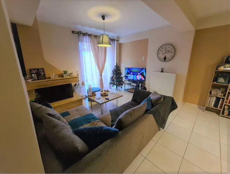 Living room and fireplace in an apartment in Patras